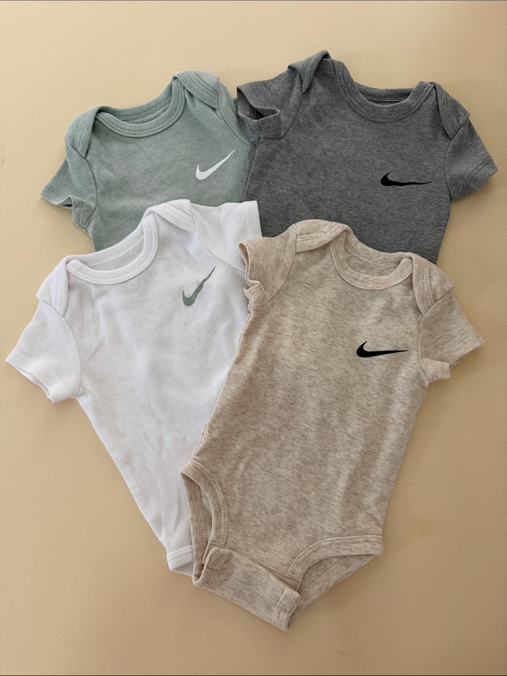 Nike 4-Pack Baby One-Piece Bodysuits — Sage, Gray, White, Tan